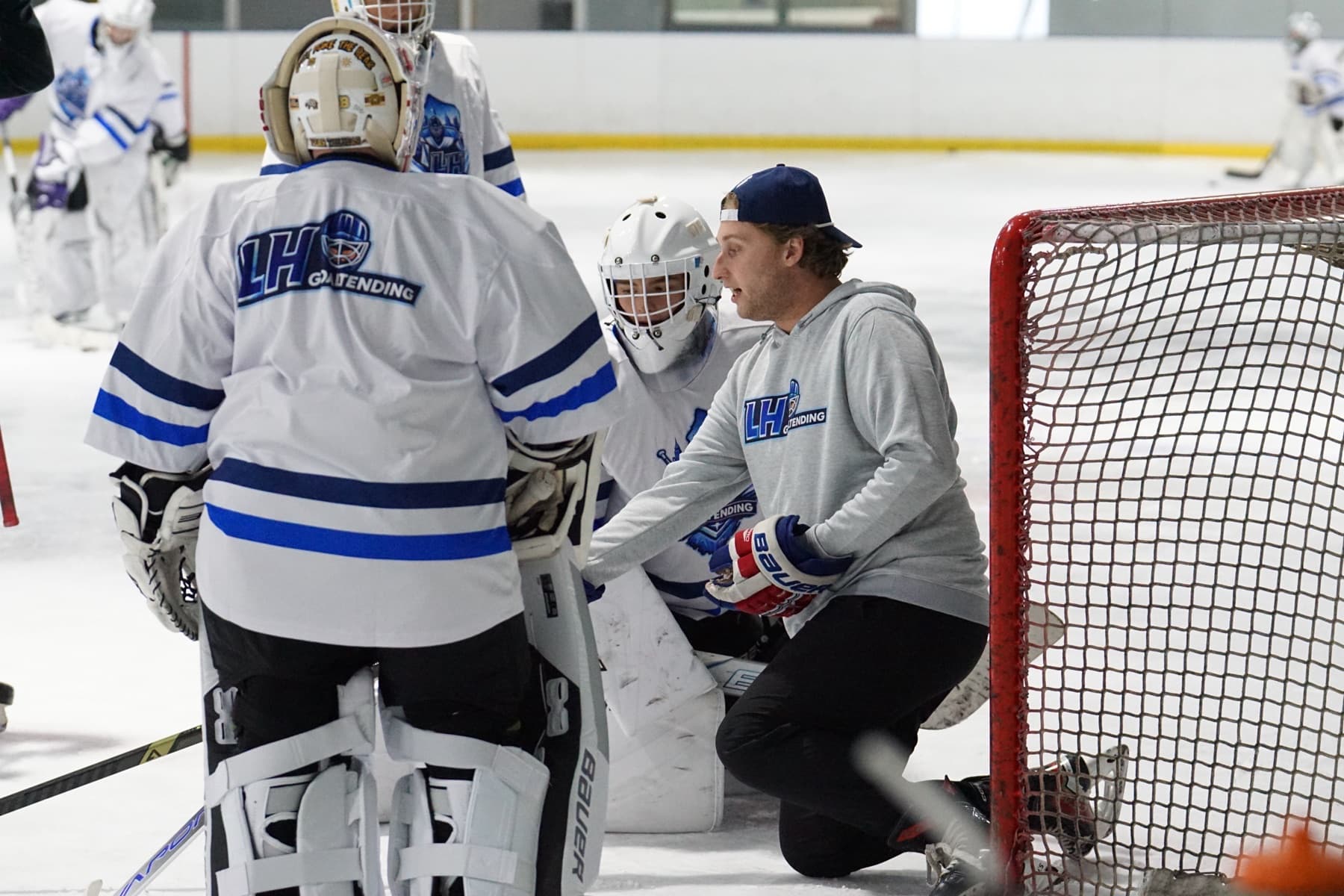 Lucas Hrabkovsky coaching goalies on ice